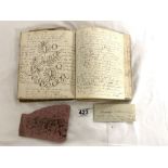 AN ANTIQUE BOOK 1840s CONTAINING HANDWRITTEN TEXT AND LOSE ITEMS