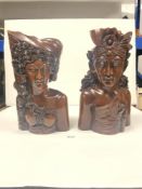 TWO CARVED HARDWOOD BUSTS OF MAN AND WOMAN FROM BALI - KHUNGKUNG, 38CMS