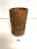 A CHINESE CARVED BAMBOO BRUSH POT DEPICTING FIGURES IN DWELLINGS, 25CMS