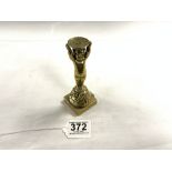 A POLISHED BRONZE MATCH STRIKER CHERUB SUPPORT STAND, 13CMS