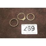 TWO 9CT GOLD WEDDING BANDS AND A 9CT GOLD THREE STONE DRESS RING COMBINED WEIGHT, 4.25 GRAMS
