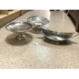 A SILVER-PLATED PIERCED SWING HANDLE CAKE BASKET, A BOAT SHAPED DISH AND A COMPORT