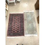 A BAKHARA RUG, 120 X 82CMS AND A CHINESE RUG, 130 X 60CMS