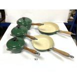 A SET OF FIVE ENAMELLED IRON SAUCPANS AND PANS