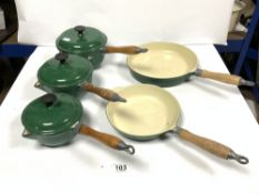 A SET OF FIVE ENAMELLED IRON SAUCPANS AND PANS