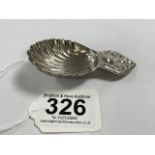 A SILVER-PLATED SHELL SHAPED CADDY SPOON