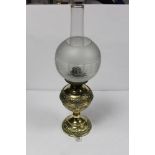 A VICTORIAN EMBOSSED BRASS BALUSTER SHAPED OIL LAMP, 60CMS