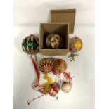SIX TEMANI BALLS, ONE ON A CUSHION IN A WOODEN BOX