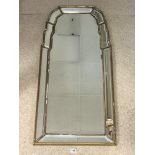 A GILT FRAMED RECTANGULAR SHAPED TOP CUSHION MIRROR WITH BEVELLED GLASS, 54 X 112CMS