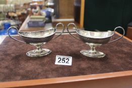A PAIR OF EDWARDIAN HALLMARKED SILVER, OVAL TWO-HANDLED PEDESTAL SALTS, BIRMINGHAM 1903 MAKERS