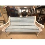A VICTORIAN PAINTED GARDEN BENCH WITH LION END ARMRESTS WITH WOODEN SLATED SEAT AND BACK MADE BY