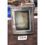 A SMALL SILVER PHOTO FRAME SHEFFIELD 1994 MAKER-HARRODS LTD, 9 X 12CMS