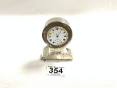 A HALLMARKED SILVER (MARKS WORN) BALLOON SHAPED DESK CLOCK ON BUN FEET (NO GLASS AND DIAL A/F)