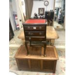 A PANELED OAK BLANKET BOX, 90 X 46 X 46CMS AND A SMALL REPRODUCTION LEATHER TOP THREE DRAWER CHEST