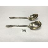 A PAIR OF DANISH HALLMARKED SILVER SERVING SPOONS WITH CAST IRON ORGANIC DECORATION TO TERMINALS