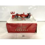 A HOT WHEEL'S LTD EDITION FORMULA 1 FERRARI MODEL INCLUDING FROM A PIECE OF AUTHENTIC FERRARI