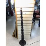 AN AFRICAN FIGURAL CARVED HARDWOOD LAMP STAND