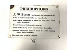 A VINTAGE ENAMEL SIGN 'PRECAUTIONS' A W BOMBS FIRE INSTANTLY ON BREAKING IN AIR, 30 X 20CMS