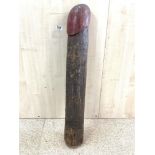 A CARVED WOODEN PHALLIC OBJECT, 84 CMS/32 INCHES