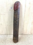 A CARVED WOODEN PHALLIC OBJECT, 84 CMS/32 INCHES