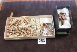 A QUANTITY OF SIMULATED PEARL NECKLACES AND A BANGLE IN CASE