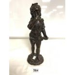 AN EARLY 20TH CENTURY BRONZE FIGURE OF A YOUNG GIRL HOLDING FLOWERS SIGNED TO BASE - 33CMS