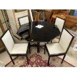 A PIERRE VANDEL 1970S/1980S BLACK AND GOLD OCTAGONAL DINING TABLE AND FOUR CHAIRS