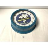 A VINTAGE STYLE MICHELIN TYRES CIRCULAR WALL CLOCK, 27CMS DIAMETER