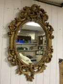 ORNATE GILDED BEVELLED WALL MIRROR, 88 X 56CMS