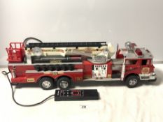 A TOY AMERICAN COMBAT FIRE ENGINE RESCUE REMOTE CONTROL FIRE ENGINE MADE BY NEW BRIGHT