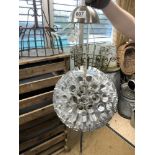 A GLOBULAR STEEL TUBULAR HANGING LAMP