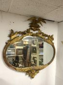 ANTIQUE GILDED REGENCY STYLE FRAMED MIRROR WITH A BIRD MOUNTED TO THE TOP, 111 X 116CMS