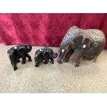 AN INDIAN CARVED WOOD ELEPHANT AND TWO EBONY ELEPHANTS