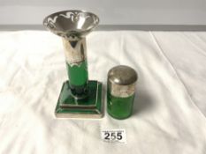 A GREEN GLASS SILVER TOPPED TOILET JAR AND A GREEN GLASS AND WHITE METAL OVERLAY CANDLESTICK (A/