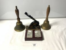 TWO CHINESE WHITE METAL MONEY TOKENS, A LETTER STAMP AND TWO HAND BELLS