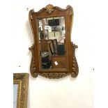 A SHAPED MAHOGANY AND GOLD PAINTED FRETWORK WALL MIRROR, 39 X 57CMS