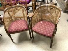 A PAIR OF TUB CHAIRS WITH CANE WORKED BACK AND SIDES