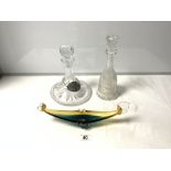 A CUT GLASS SHIPS DECANTER WITH BRANDY LABEL, ANOTHER CUT GLASS DECANTER AND A GLASS BOAT SHAPED