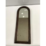 A DOME TOP HALL MIRROR 23 X 64 IN A MAHOGANY FRAME