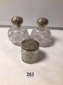 A PAIR OF CUT GLASS SILVER TOP SCENT BOTTLES, SILVER TOPS CHESTER 1897/98 AND A STAMPED SILVER TOP