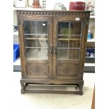 A REPRODUCTION SOLID OAK AND LEADED GLASS DWARF CABINET, 82 X 100CMS