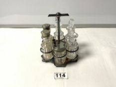 A HUKIN & HEATH SIX BOTTLE PLATED CRUET, 14CMS