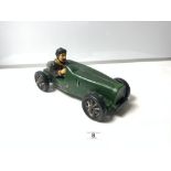 A REPRODUCTION CERAMIC MODEL OF A 1930'S CAR AND DRIVER