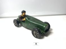A REPRODUCTION CERAMIC MODEL OF A 1930'S CAR AND DRIVER