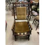 A LATE VICTORIAN WALNUT FRAMES ROCKING CHAIR WITH SPINDEL SUPPORTS