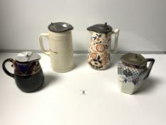 FOUR VICTORIAN CERAMIC WATER JUGS WITH PEWTER LIDS