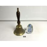 A BRASS HAND BELL AND A GLASS PAPERWEIGHT