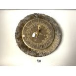 A REPRODUCTION BRASS SIGNS OF THE ZODIAC SUN DIAL (A/F) ON A CIRCULAR STONE PLINTH, 33CMS