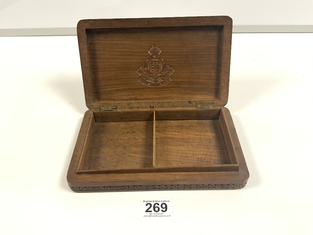 A CARVED HARDWOOD CIGARETTE BOX WITH A MILITARY CREST FOR ROYAL CORPS ARMY ORDNANCE