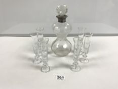 A SET OF SIX CORDIAL GLASSES WITH LOAD LINE MARKINGS AND A WAISTED GLASS DECANTER WITH A